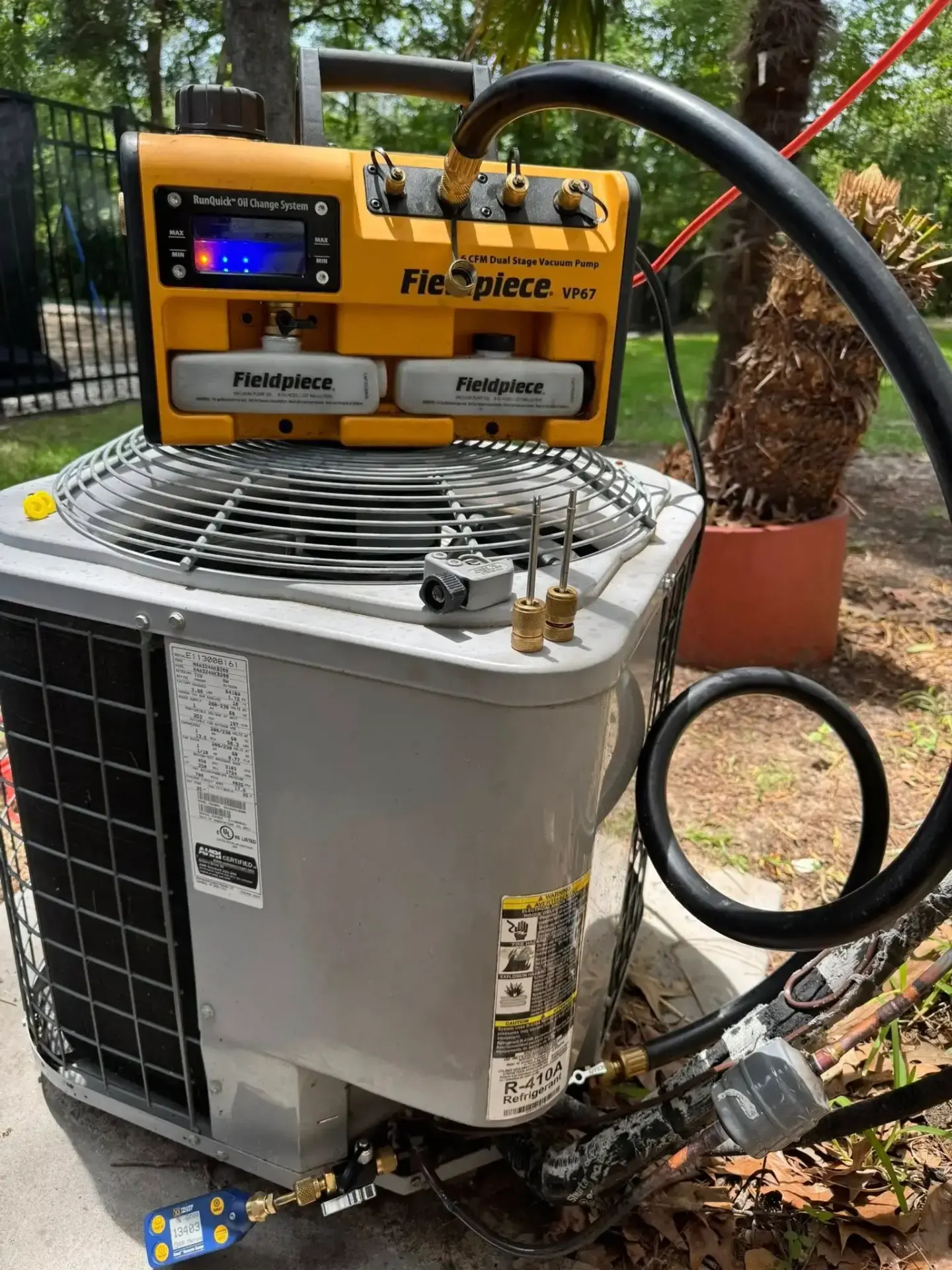 Professional HVAC diagnostic equipment used during AC maintenance